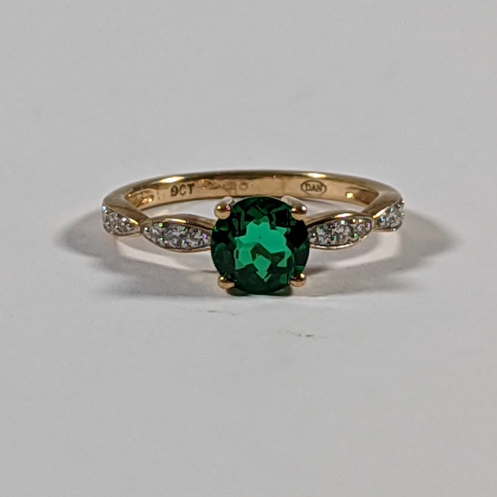 Product photo for 9ct Gold Bottle Green Stone & Tiny White Engagement Style Ring Size K