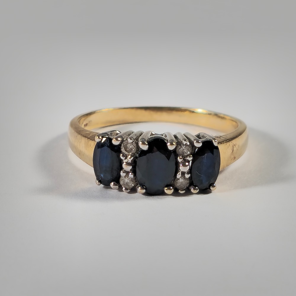 Product photo for 9ct Gold Oval Dark Blue Sapphire & Tiny Diamond Half Band Ring Size K1/2