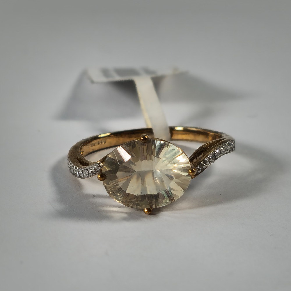 Product photo for 9ct Gold Oval Pale Yellow Stone & Tiny Diamond Size M1/2