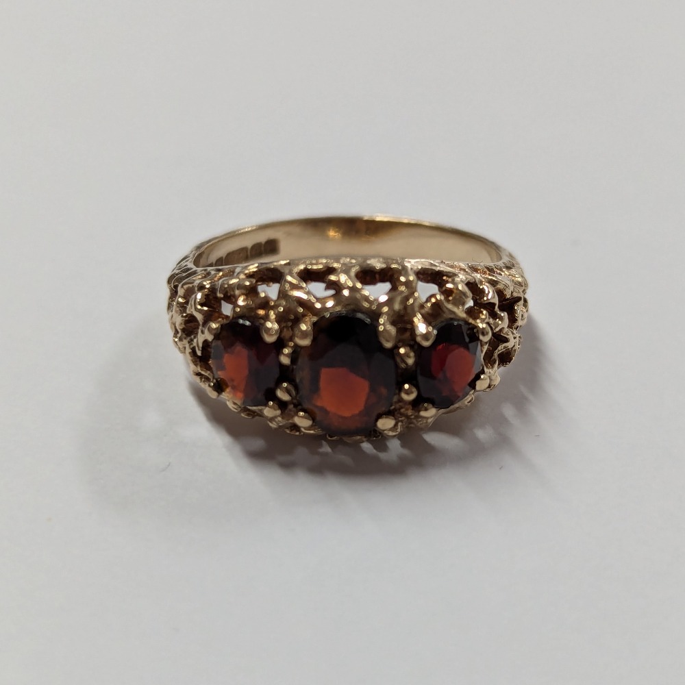 Product photo for 9ct Gold 3 Red Stone Pierced Half Band Ring Size O