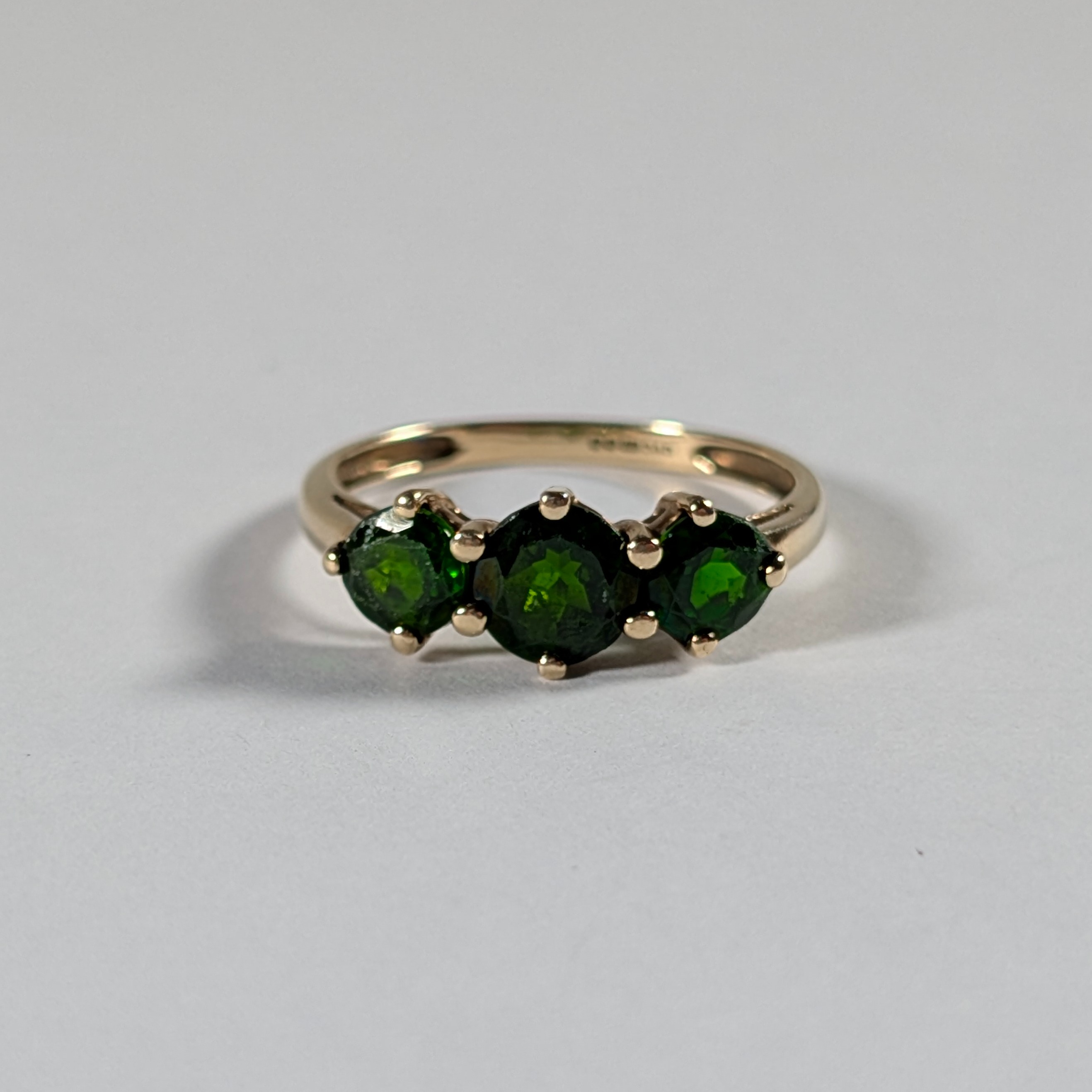 Product photo for 9ct Gold Round Bottle Green Stone Trilogy Ring Size O1/2