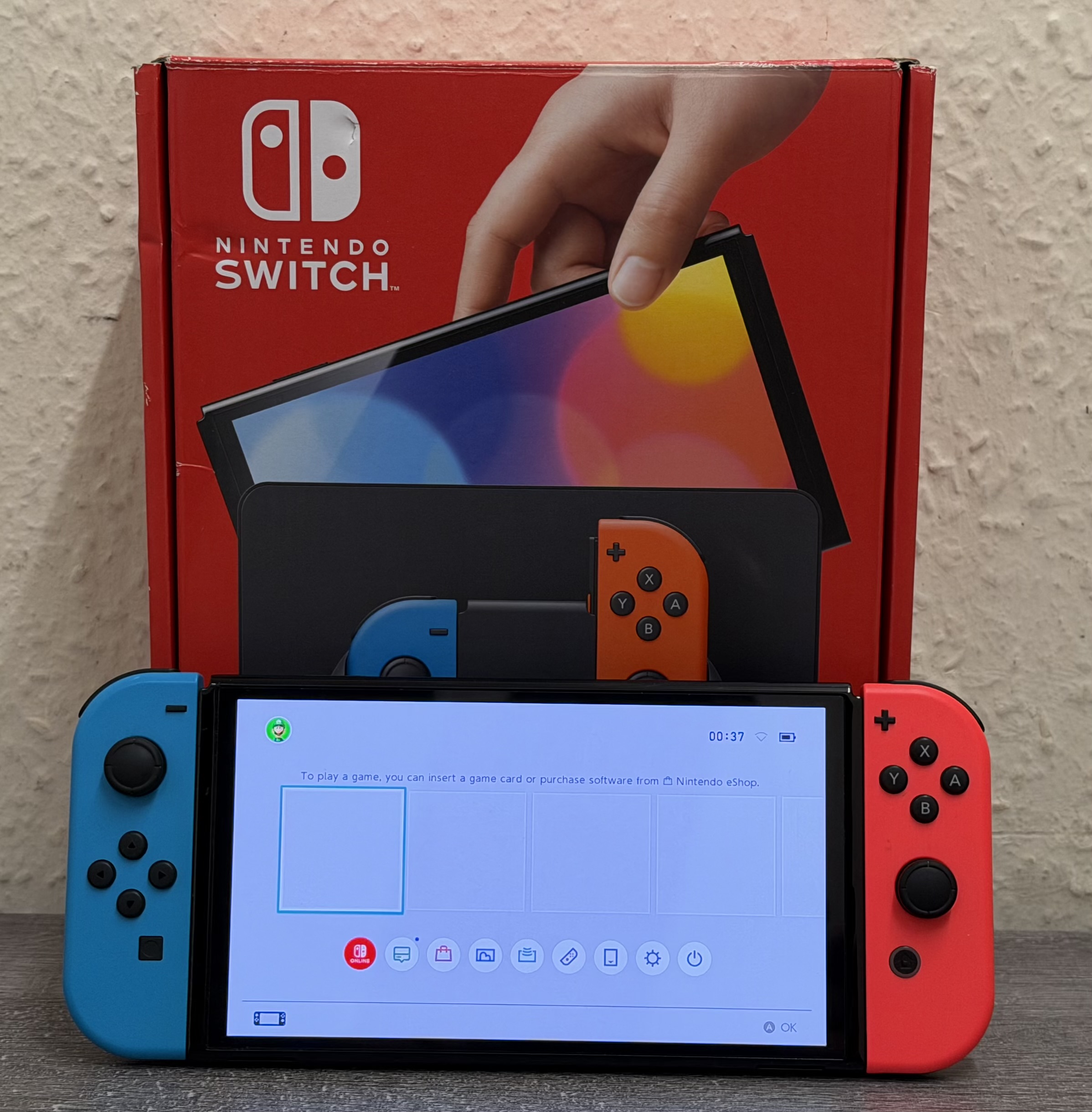 Product photo for NINTENDO SWITCH OLED CONSOLE 64GB RED AND BLUE - BOXED
